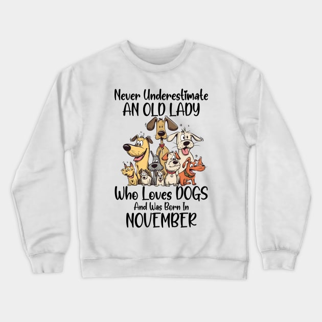 Never Underestimate An Old Lady Who Loves Dogs And Was Born In November Crewneck Sweatshirt by D'porter